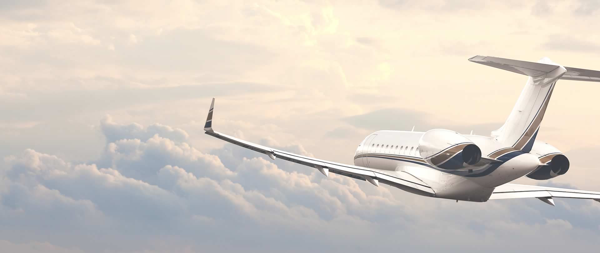 Private jet flying through a cloudy sky